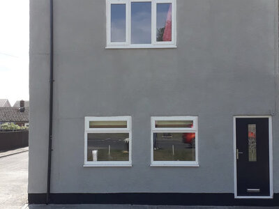 Protective wall coating on semi-detached home